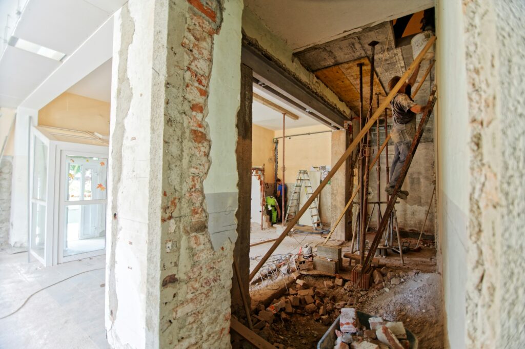Opening in a brick wall held up with temporary props during building work