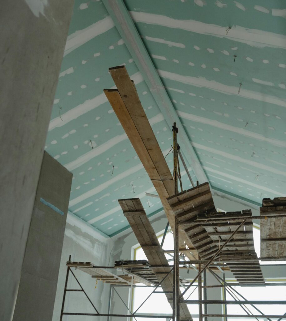 Exposed roof timbers and insulation during a loft conversion